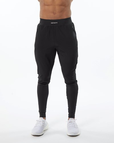 Alphalete Woven 4-Way Stretch 29" Pant Blackout | WT3601479