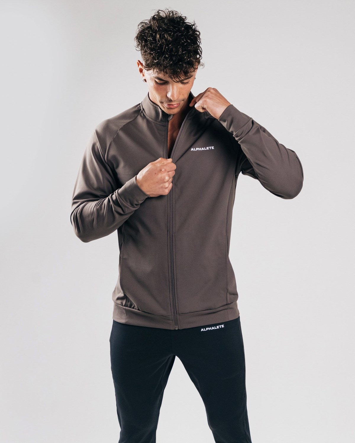 Alphalete 4-Way Stretch Track Jacket Striker | XY7523694